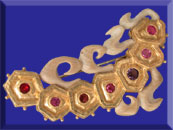 picture of carved fossil ivory wheat brooch with gems and 24K gold